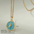 Detail of seashell charm with blue enamel showing 15mm height and stainless steel chain - Blue Irregular Shell Round Pendant (MFNK032G16)