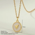 Macro shot of gold enamel heart pendant with stainless steel chain and product dimensions - White Round Heart Pendant (MFNK032G15)