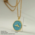 Macro shot of 14mm blue enamel fishtail pendant on stainless steel gold necklace - Irregular Whale Tail Round Pendant (MFNK032G7)