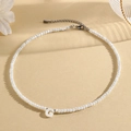 Elegant white beaded necklace featuring a shell letter G pendant with adjustable silver chain - G (SHNK2434)