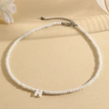 White faceted bead necklace featuring a central letter H pendant and silver extender - H (SHNK2434)