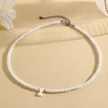 Choker necklace featuring white faceted beads and a mother-of-pearl letter I pendant - I (SHNK2434)