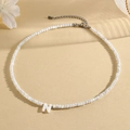 Elegant beaded necklace with white faceted beads and mother of pearl letter N pendant - N (SHNK2434)