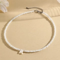 Handmade beaded necklace with a white resin letter R pendant and silver clasp - R (SHNK2434)
