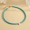 Blue turquoise beaded necklace with a white shell letter C pendant and gold-tone clasp - C (SHNK2435)