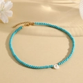 Sky blue turquoise bead necklace featuring a golden letter G pendant and lobster clasp - G (SHNK2435)