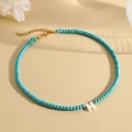 Natural turquoise bead necklace with a white letter H pendant and gold lobster clasp - H (SHNK2435)