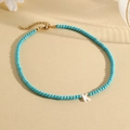 Sky blue beaded necklace with white letter K pendant and adjustable gold clasp - K (SHNK2435)