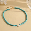 Blue turquoise beaded necklace featuring a white shell letter M pendant and gold clasp - M (SHNK2435)