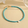 Blue turquoise beaded necklace with a white letter R shell pendant and gold chain - R (SHNK2435)