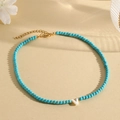 Turquoise beaded necklace featuring shell letter V pendant and gold lobster clasp - V (SHNK2435)