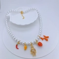 Faux pearl necklace with colorful charms like chili, teddy bear, and strawberry - Red Chili Strawberry Style (#2)