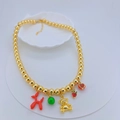Detail of gold beaded necklace with red balloon dog, gold bear and enamel charms - Red Balloon Dog Gold Bead Necklace Style (#7)