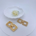 Golden square clasp necklace link with pave cubic zirconia on a white pedestal - Gold