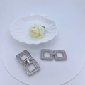 Close-up of interlocking square earrings with micropave cubic zirconia settings - Silver