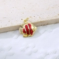Close-up of tropical fish pendant featuring red enamel inlay and golden copper finish - Red Style 2