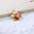 Macro shot of tropical fish pendant in gold metal with red enamel stripes detailing - Red 4