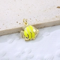 Macro view of gold-plated fish pendant with bright yellow enamel on textured background - Yellow 1
