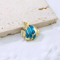 Macro shot of tropical fish pendant with blue enamel and gold-plated scales texture - Blue 1