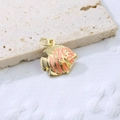 Detail of a gold copper fish pendant with orange enamel stripes on a stone surface - Pink Style 4