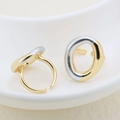 Close-up of two-tone open rings featuring gold and silver irregular oval metal designs - Minimalist Irregular Oval Style (#4)