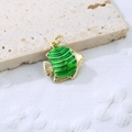 Detailed close-up of a golden tropical fish pendant with green enamel on stone - Green 3