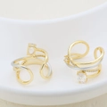 Detail of two-tone layered ring featuring sparkling oval and round cubic zirconia stones - Multi-layer Cross Rhinestone Style (#11)