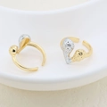 Detail of minimalist two-tone irregular open rings with hammered texture on a ceramic tray - Hammered Ball Design (#9)