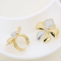 Detailed view of two-tone clover ring with sparkling center zircon and open band - Four-leaf Clover Rhinestone Design (#12)