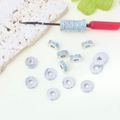 Macro detail of silver spacer beads with turquoise zircon stones on DIY jewelry tool - 8mm / Silver / Cyan Zirconia