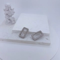 Macro shot of silver rectangle huggie earrings with white zircon pavé on stone base - Silver Rectangle (18x30mm)