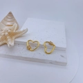 Macro shot of 18k gold plated heart screw clasps with zircon inlay on stone base - Gold Plated Clear Zirconia Style
