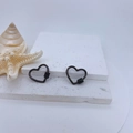 Macro shot of heart-shaped screw clasp in gun black finish with micro-pave zircons - Gun Black Plated Black Zirconia Style