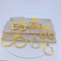 Five styles of gold-plated geometric earrings displayed on a minimalist stone plate - Hollow Pentagram Wide Hoop (#18)