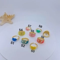 Macro view of evil eye and heart rings collection with colorful enamel and gold plating - Evil Eye Style No. 51 (51)