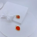 Detail of shield-shaped gold pendants with star engraving and orange enamel finish - Enamel Red (#5)