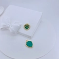 Detail of shield-shaped malachite pendants with 18K gold plating and zircon star inlay - Turquoise Blue (#6)