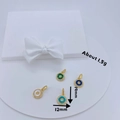 Detailed view of 18K gold evil eye pendants featuring zirconia and colorful gemstones - Evil Eye Round Pendant / 7# Green (Evil Eye)