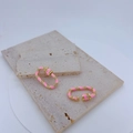 Golden twist earrings with pink enamel and micro-set cubic zirconia on stone base - Pink