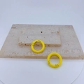 Macro shot of two yellow round spring gate rings for jewelry and keychain accessories - Yellow