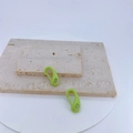 Macro detail of green macaron lobster clasps on stone base for DIY jewelry making and crafts - Light Green