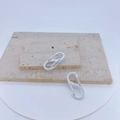 Dual white S-shaped carabiners displayed on stone slabs for backpack and key accessories - Pure White