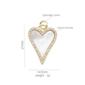 Macro detail of a gold heart pendant with white mother of pearl and cubic zirconia stones - Heart Hollow Shell Pendant (#19)