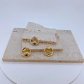 Detailed view of three gold-plated Evil Eye pendants with blue stones on stone texture - Blue Center Stone Pendant Only (Without Chain)