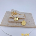 Golden dollar sign coin pendant necklace with a textured back on stone display - Dollar Sign Style Gold (Pendant Only)