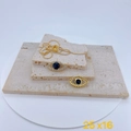 Detailed close-up of gold evil eye necklace with blue zircon on beige stone plates - Blue Evil Eye Style Gold (Pendant Only)