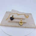 Macro detail of heart pendant with black zircon pavé and golden openwork structure - Pendant Only / Black