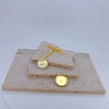 Detail of gold sun and moon pendant with white enamel on natural stone display - White - Pendant Only (Without Chain)