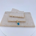 Macro shot of gold-plated pill pendant with sky blue enamel and micro-set zircon accents - Sky Blue Style (ML)