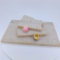 Macro detail of gold-plated evil eye pendants on natural stone, showing pink enamel finish - Pinkish Purple Egg Shape / Pendant Only (Without Chain)